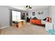 Bedroom with a ceiling fan, large window, and a cozy atmosphere at 6126 Navy Cir, Indianapolis, IN 46221