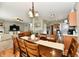 Open layout with dining room and view of kitchen, living room and fireplace at 6126 Navy Cir, Indianapolis, IN 46221