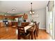 Open layout with dining room, kitchen, and a view of the stainless steel refrigerator at 6126 Navy Cir, Indianapolis, IN 46221