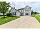 Charming two-story brick home featuring blue shutters and a well-maintained front yard at 6126 Navy Cir, Indianapolis, IN 46221