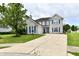 Beautiful two-story brick home featuring blue shutters and a well-maintained front yard and driveway at 6126 Navy Cir, Indianapolis, IN 46221