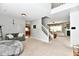 Spacious living room with fireplace, neutral tones, carpeted floor, and open floor plan provides space to gather at 6126 Navy Cir, Indianapolis, IN 46221