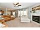 Open-concept living room features a fireplace, ample natural light, and cozy seating at 6126 Navy Cir, Indianapolis, IN 46221