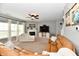 Bright living room with natural light, fireplace, and comfortable seating arrangement at 6126 Navy Cir, Indianapolis, IN 46221