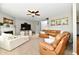 Inviting living room features a fireplace, ceiling fan, and comfortable seating at 6126 Navy Cir, Indianapolis, IN 46221