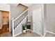 Bright stairway with white railings and a decorative ladder, adding a cozy touch at 6126 Navy Cir, Indianapolis, IN 46221