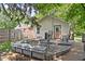 Wooden deck with seating provides a cozy spot to entertain in the private backyard at 6142 Evanston Ave, Indianapolis, IN 46220