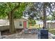The backyard presents a cozy deck with a table and chairs, perfect for outdoor dining and entertainment at 6142 Evanston Ave, Indianapolis, IN 46220