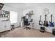Neutral bedroom features a desk, guitars, and built in shelving perfect for an office at 6142 Evanston Ave, Indianapolis, IN 46220
