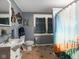 Quaint bathroom with sink, toilet, bathtub, and unique artwork at 6208 S 200 W, Trafalgar, IN 46181