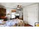 Comfortable bedroom featuring hardwood floors, a ceiling fan, and a TV on a bureau at 6208 S 200 W, Trafalgar, IN 46181