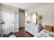 Bedroom with neutral walls, dresser, and door access to other rooms at 6208 S 200 W, Trafalgar, IN 46181