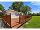 Wood deck with railing, view of lawn, steps, and house exterior at 6208 S 200 W, Trafalgar, IN 46181