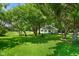 Beautiful home with a large, lush lawn, mature trees and landscaping at 6208 S 200 W, Trafalgar, IN 46181
