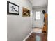 Hallway with decor, wood-look floor, and door to the outside at 6208 S 200 W, Trafalgar, IN 46181