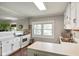 Charming kitchen featuring white appliances, white cabinets, and hardwood floors at 6208 S 200 W, Trafalgar, IN 46181