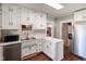 Bright kitchen with stainless steel appliances, white cabinets, and an island at 6208 S 200 W, Trafalgar, IN 46181