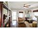 Cozy living room featuring a fireplace, hardwood floors, and natural light, creating an inviting atmosphere at 6208 S 200 W, Trafalgar, IN 46181