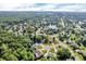 Scenic aerial view of a neighborhood featuring homes, trees, and a tranquil lake at 6374 Timberbluff Cir, Avon, IN 46123