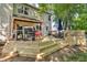 Multi-level wooden back deck with grill, patio seating, and stairs down to yard at 6374 Timberbluff Cir, Avon, IN 46123