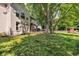 Spacious backyard featuring a large deck and a playground, surrounded by mature trees at 6374 Timberbluff Cir, Avon, IN 46123