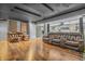 Finished basement with theater seating, wood flooring, and ample space for entertaining at 6374 Timberbluff Cir, Avon, IN 46123