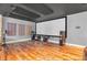 Home theater features large projection screen, surround sound system, and acoustic wall panels at 6374 Timberbluff Cir, Avon, IN 46123