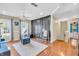 Versatile bonus room with hardwood floors, decorative wall, and abundant natural light at 6374 Timberbluff Cir, Avon, IN 46123
