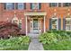 Charming red brick home with well-manicured landscaping and inviting front entrance at 6374 Timberbluff Cir, Avon, IN 46123