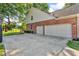 Two-car garage with long driveway, basketball hoop and beautiful landscaping at 6374 Timberbluff Cir, Avon, IN 46123