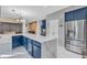 Spacious kitchen with a large center island, stainless steel appliances, and custom blue cabinetry at 6374 Timberbluff Cir, Avon, IN 46123