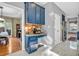 Stylish kitchen with custom blue cabinetry, stainless steel appliances, and a functional coffee bar area at 6374 Timberbluff Cir, Avon, IN 46123