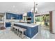 Bright, modern kitchen with a large island, stainless steel appliances, and marble countertops at 6374 Timberbluff Cir, Avon, IN 46123