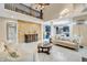 Elegant living room featuring tile floors, a stone wall, and an open view of the kitchen at 6374 Timberbluff Cir, Avon, IN 46123
