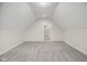 Open bedroom space with neutral walls and carpet with a view into the bathroom at 6553 Stone Pointe Way, Indianapolis, IN 46237
