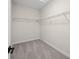 Walk-in closet space with carpeted floors and white wire shelving at 6553 Stone Pointe Way, Indianapolis, IN 46237