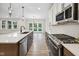 Spacious kitchen with an island, stainless steel appliances, and an open view to the dining area at 6553 Stone Pointe Way, Indianapolis, IN 46237