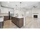 Gourmet kitchen features stainless steel appliances, large island, and modern lighting at 6553 Stone Pointe Way, Indianapolis, IN 46237