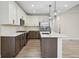 Modern kitchen featuring pendant lighting, stainless steel appliances, and a large island at 6553 Stone Pointe Way, Indianapolis, IN 46237