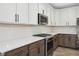 Modern kitchen featuring two-tone cabinetry, stainless steel appliances, and white subway tile backsplash at 6553 Stone Pointe Way, Indianapolis, IN 46237