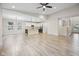 Bright, open living space with modern finishes, hardwood floors, and smooth transition to the kitchen at 6553 Stone Pointe Way, Indianapolis, IN 46237