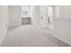 Loft area with plush carpeting, a built-in desk, and natural light at 6553 Stone Pointe Way, Indianapolis, IN 46237