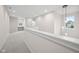 Open loft area with neutral paint, plush carpeting, and natural light at 6553 Stone Pointe Way, Indianapolis, IN 46237