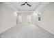 Spacious main bedroom with carpet floors, neutral paint, tray ceiling, and two doors leading to a closet and ensuite bathroom at 6553 Stone Pointe Way, Indianapolis, IN 46237