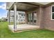 Covered patio area with brick and gray trim, perfect for outdoor entertaining at 6553 Stone Pointe Way, Indianapolis, IN 46237