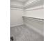 A large walk-in closet with rods and shelves provides ample storage space at 6553 Stone Pointe Way, Indianapolis, IN 46237