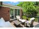 Backyard deck with outdoor furniture and a brick exterior at 6570 Freemont Ln, Carmel, IN 46033