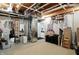 Unfinished basement with exposed pipes, wooden ceiling, and mechanical equipment at 6570 Freemont Ln, Carmel, IN 46033