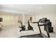 Finished basement featuring neutral carpet, exercise equipment, and an open floor plan at 6570 Freemont Ln, Carmel, IN 46033