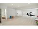 Spacious finished basement with new carpet, recessed lighting, and room for recreation at 6570 Freemont Ln, Carmel, IN 46033